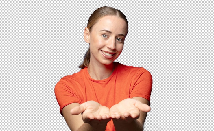 PSD gratuit souriant joyeusement avec un regard amical confiant et positif offrant et montrant un objet ou un concept