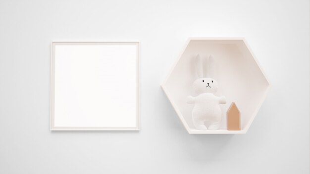 Maquete de moldura em branco pendurado na parede ao lado de um brinquedo de coelho