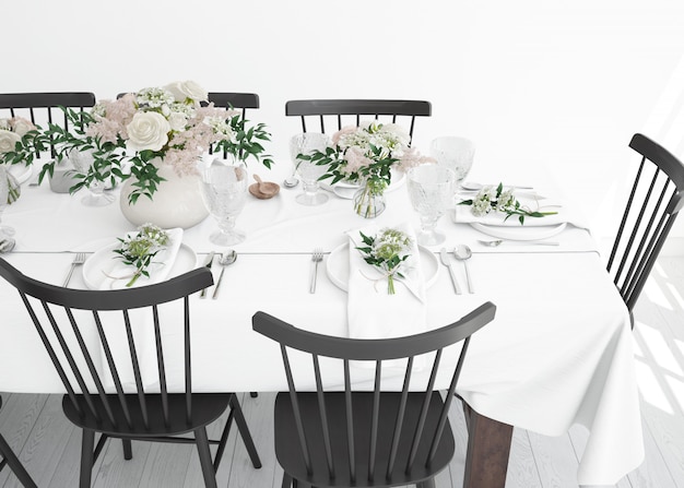 mesa preparada para comer com talheres e flores decorativas