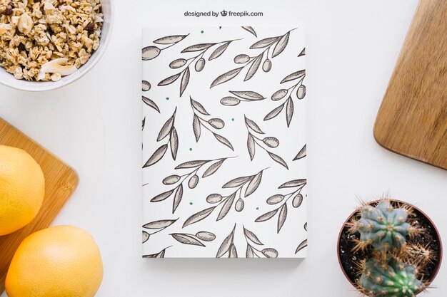 Mockup de capa de livro com grapefruits e cactus