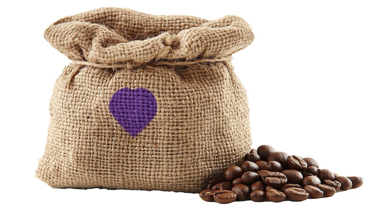 PSD a burlap sack with a purple heart and coffee beans