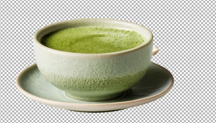 A ceramic cup filled with frothy green matcha tea energizes the spirit
