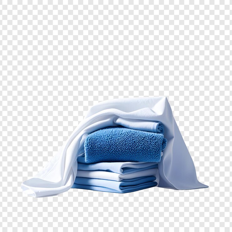 a stack of towels with a white sheet on it
