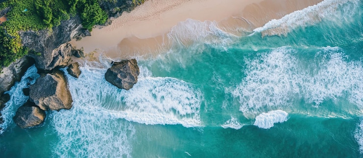 PSD aerial view of a beach with turquoise water and waves
