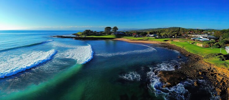 PSD aerial view of a coastline with turquoise water and waves