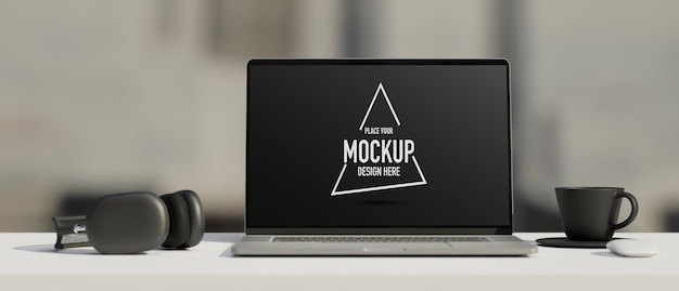 Area di lavoro in bianco e nero con cuffie per laptop mockup e rendering 3D della tazza