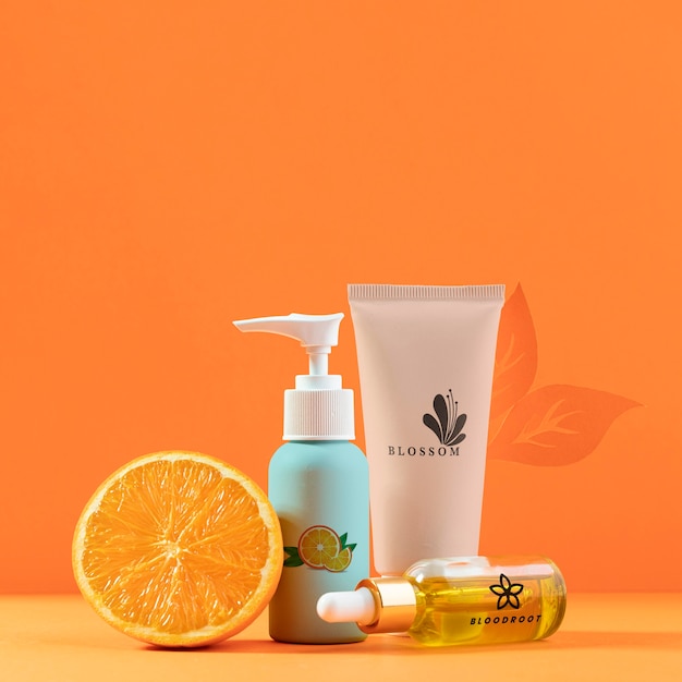 PSD arrangement avec moitié orange et cosmétiques