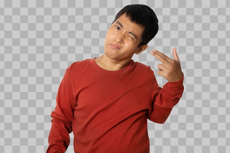 PSD asian young man pointing with finger to head like he shoots himself