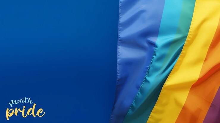 PSD bandera del orgullo psd sobre un fondo azul con texto editable bandera del arco iris amor y día del orgullo de la diversidad