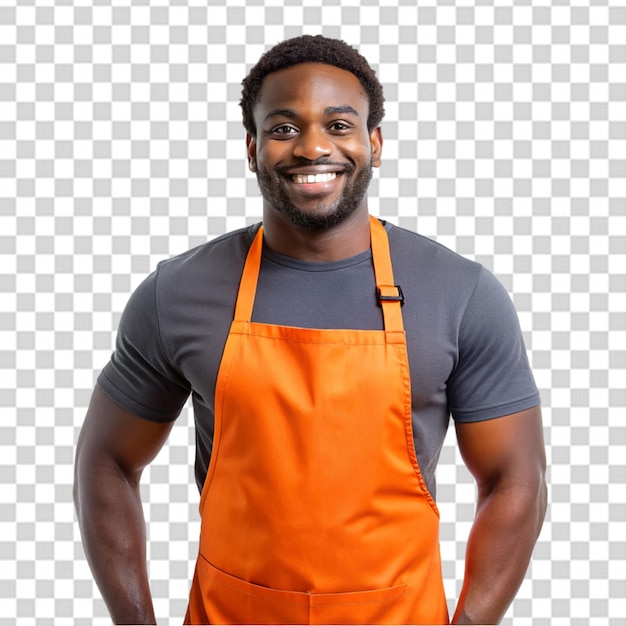 PSD barista heureux pointant le doigt à gauche et souriant portant un uniforme de tablier noir debout contre