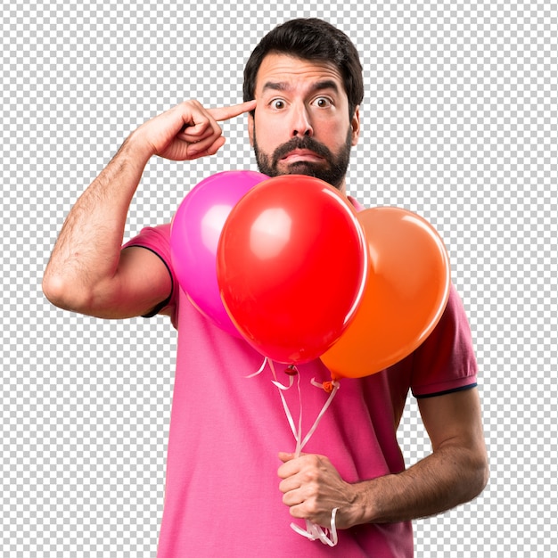 Beau jeune homme, geste fou, tenue, ballons
