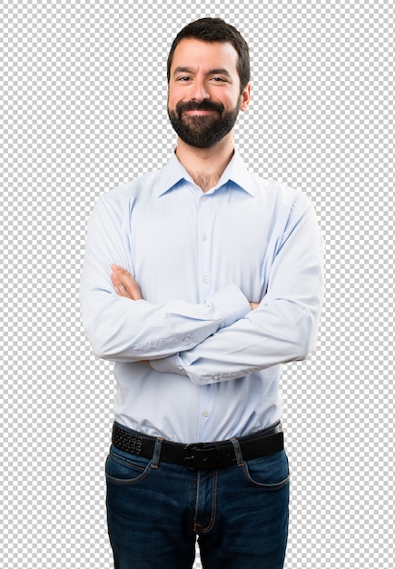 Bel homme à la barbe avec les bras croisés