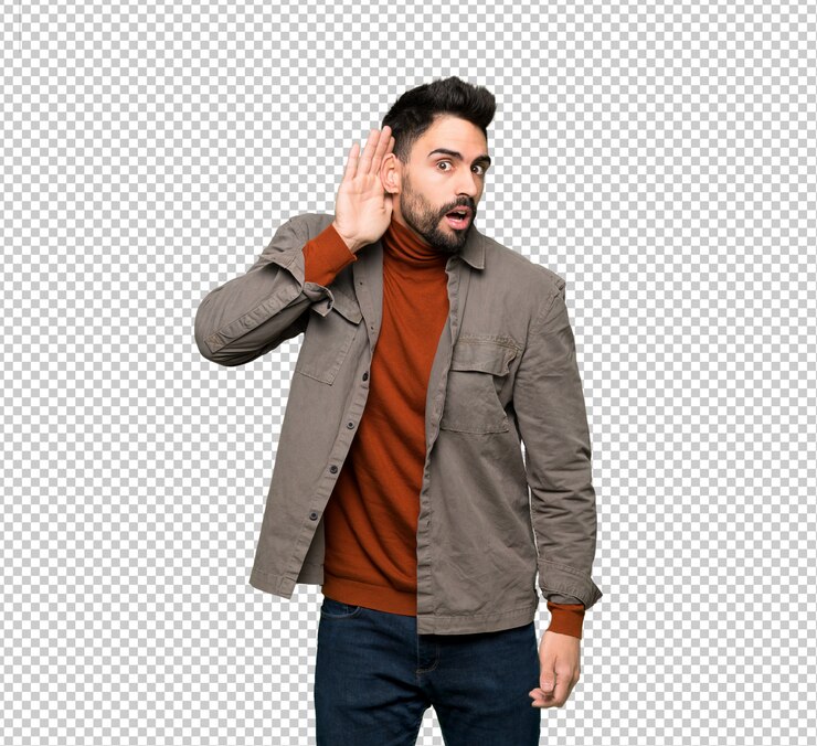 PSD bel homme à la barbe écoutant quelque chose en mettant la main sur l&#39;oreille