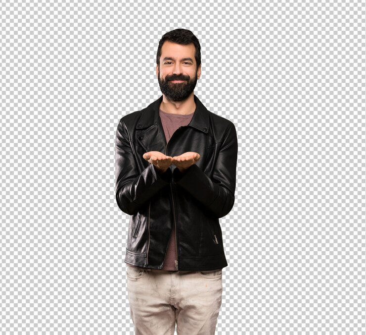 PSD bel homme à la barbe tenant une surface imaginaire sur la paume pour insérer une annonce