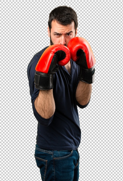 Bell&#39;uomo con la barba con i guantoni da boxe