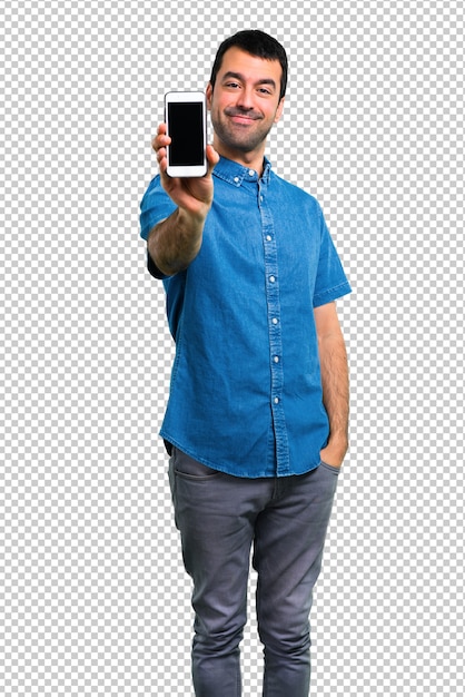 Bell'uomo con la camicia blu parlando al cellulare