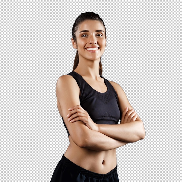 Bella chica deportiva posando con los brazos cruzados sobre una pared oscura