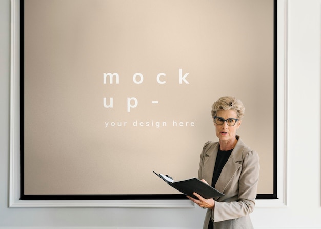 Blonde aged woman having a presentation mockup