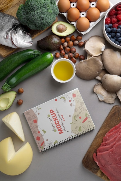 PSD bodegón de ingredientes de la dieta cetogénica con maqueta de cuaderno