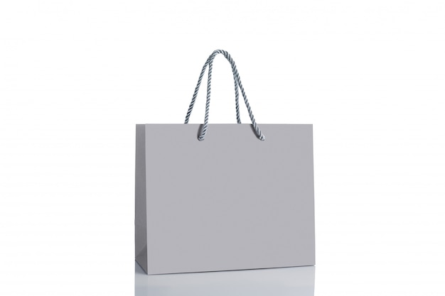 Bolso de compras de papel gris aislado.