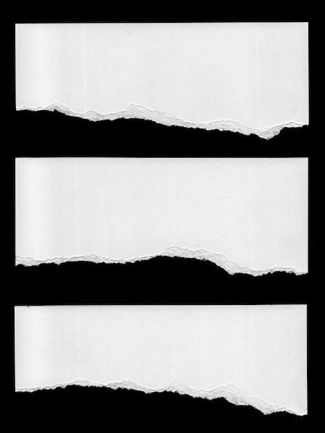 Un bord de papier blanc déchiré sur un fond noir