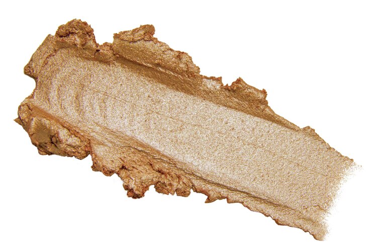 PSD bronze cream smear with curved form on white background