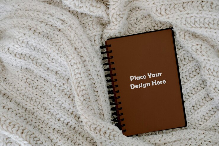 PSD brown notebook auf jacket mockup psd für schreibwaren und fashion branding