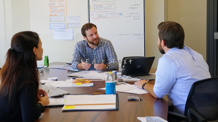 PSD business team meeting around table discussing project