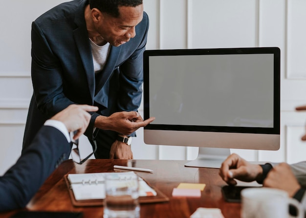 Businessman presenting a project on a computer desktop mockup