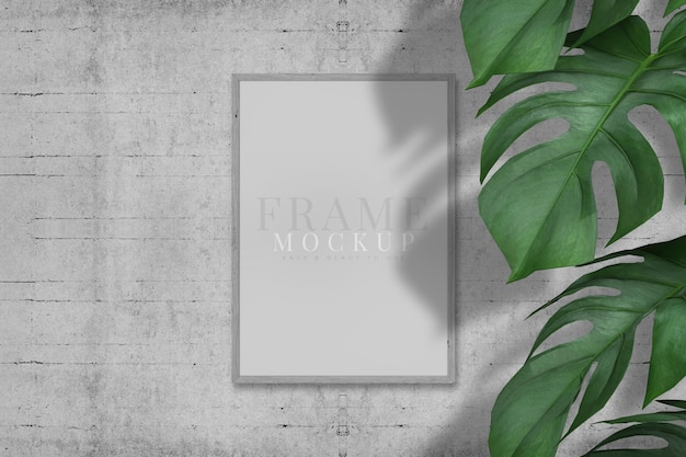Cadre photo vierge pour les graphiques d'art de photographies avec modèle de maquette de cadre de feuilles sur la texture de fond rendu 3D