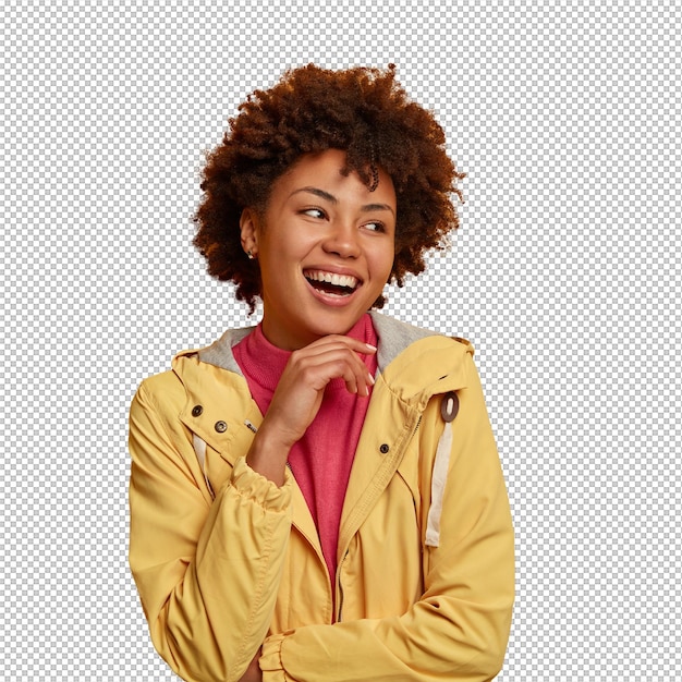 Capture d'une jolie femme insouciante tenant la main sous le menton regarde de côté porte une veste pose contre le mur jaune espace libre de côté pour votre contenu publicitaire émotions et sentiments concept