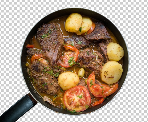 Carne en la sartén con caldo y verduras