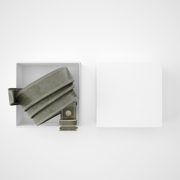 Ceinture roulée à l'intérieur d'une boîte blanche