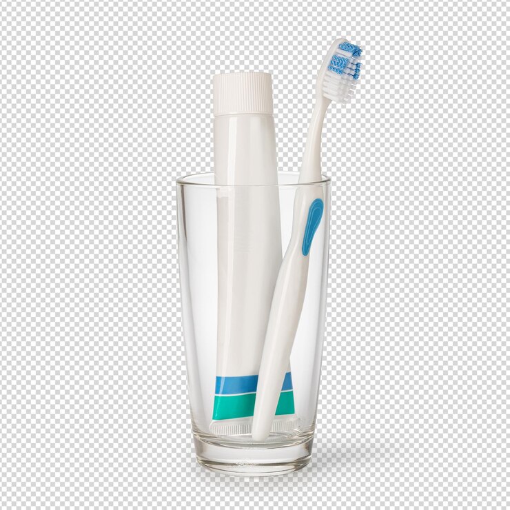 Un cepillo de dientes en un vaso con un cepillo de dentadas azul y blanco en él