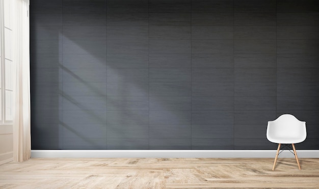 Une chaise blanche contre une maquette de mur gris
