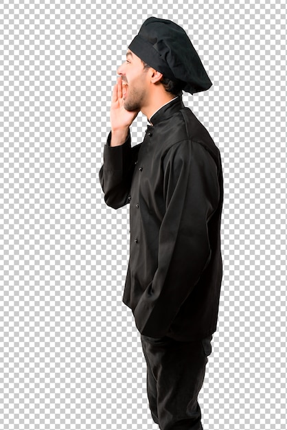 chef man in black uniform shouting with mouth wide open to the lateral and announcing something