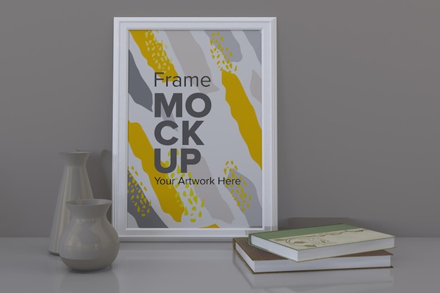 close de uma maquete de moldura branca com vasos e livros na prateleira