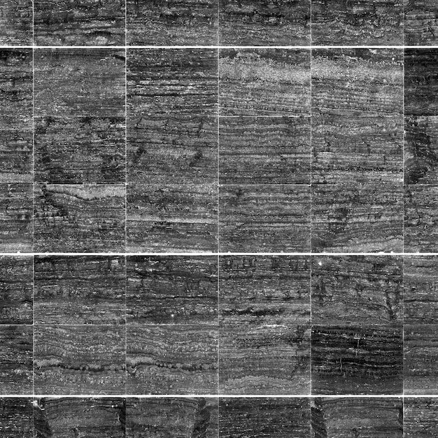 Close-up di una parete di piastrelle di pietra con struttura dettagliata e struttura a strati