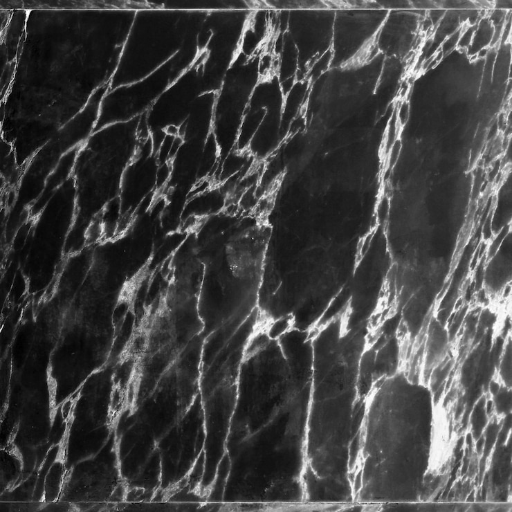 PSD close-up di una superficie di marmo nero con vene bianche