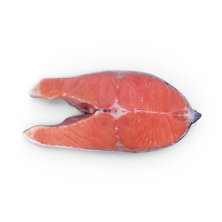 PSD close-up of a fresh salmon steak on a white surface