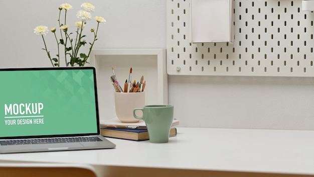 Close up on home office desk with laptop mockup