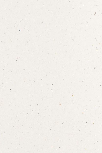 Close-up de papier crème texturé avec des grains et des taches subtils