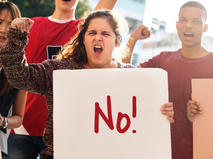 PSD closeup of angry teen girl protesting demonstration holding posters antiwar justice peace concept