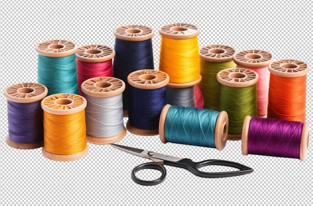Colección de coloridos carretes de hilo y tijeras en la mesa