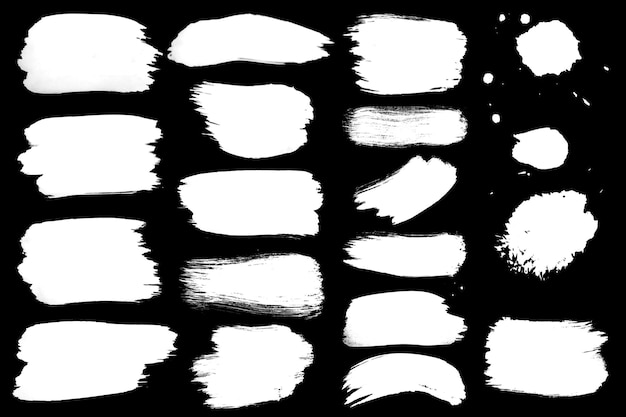 Collection de coups de pinceau blanc et d'éclaboussures sur noir