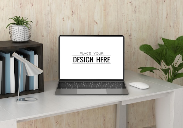 Computer portatile sulla scrivania nello spazio di lavoro PSD mockup