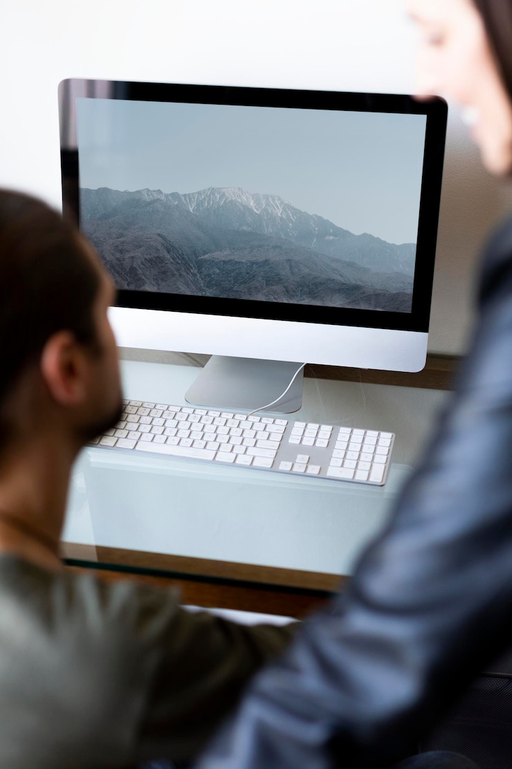 PSD computer screen mockup in an office