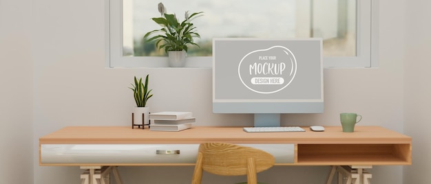 Computergerät mit Mockup-Bildschirm auf Holzschreibtisch mit Büchern