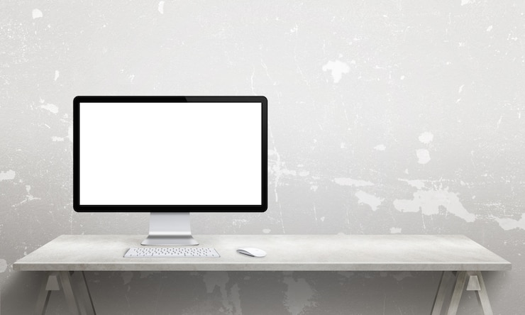 PSD comuter display mockup on office desk with copy space beside on wall