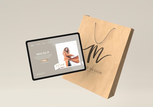 Concept commercial avec tablette et sac en papier